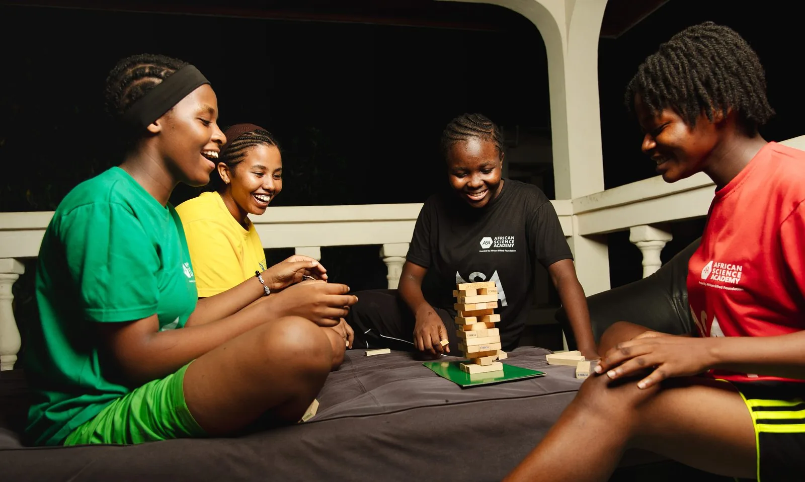 ASA students playing Jenga together on campus in the evening