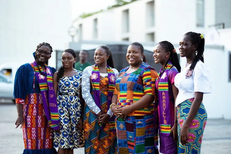 ASA team gathered together in branded attire outside the school